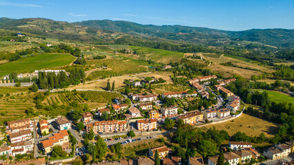Naklejka premium An aerial view of Greve in Chianti, a charming town in the heart of the Chianti wine region in Tuscany, Italy, captured by a drone. Known for its picturesque vineyards, olive groves