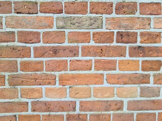 Obraz premium minimalistisches Hintergrundbild - Nahaufnahme einer Backsteinmauer in Neustrelitz, Mecklenburg - Vorpommern