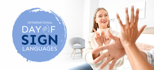 Young deaf mute couple using sign language at home