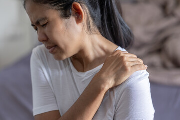 Asian woman with shoulder pain