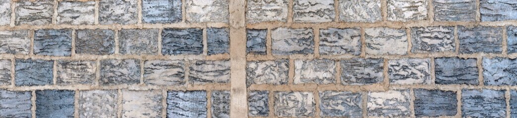 Banner with stone texture in mosaic shapes in shades of blue and gray