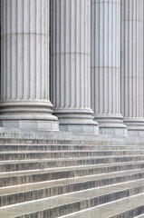 Stone colonnade and stairs detail. Classical pillars row in a building facade