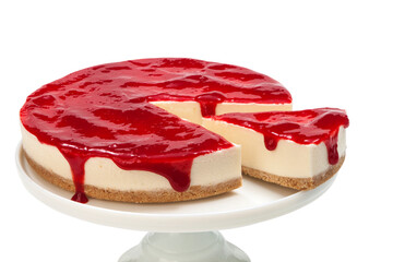 Cheesecake with strawberry sauce on a neutral background