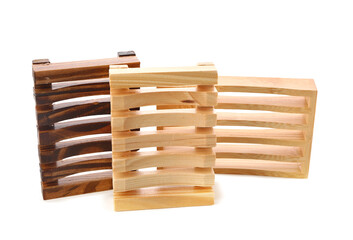 Set of wooden soap dishes isolated on white background