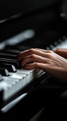 Fototapeta premium A close up of a person's hands playing a piano