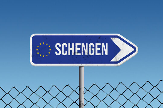 Schengen Sign Against Blue Sky and Fence