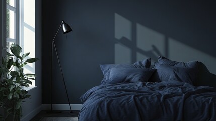 A bedroom with a black bed and a black lamp