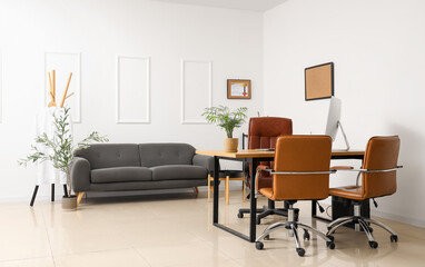 Light interior of doctor's office with modern workplace