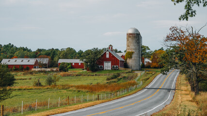 Upstate New York Red Barn Side of the Road in Autumn. Rural Road Next to Farm with Silo. Classic American View with © And They Travel