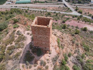 Aerial views taken with a drone of the Almenara Castle, ruins of a medieval fortification made of stone and brick, of Arab and Roman origin