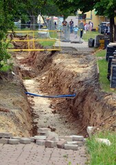 Excavation work to replace the old steel pipes of the water heating plant