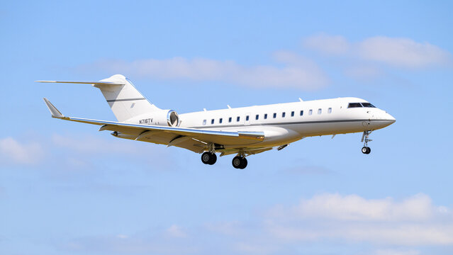 Everett, WA, USA - July 28, 2024; White Bombardier BD-700-1A10 Global 6000 on final approach to land with no logo