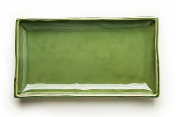Green ceramic plate on white background
