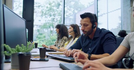 Professional diverse managers remotely offering customers new products and company services. Workers using headset for remote consultation. Entering call information on computers. Contact center. - Powered by Adobe