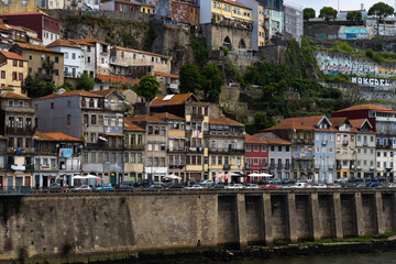 View of Porto city and Douro river and Dom Luis bridge. Porto, Vila Nova de Gaia, Portugal. Cityscape along the river