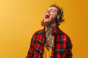 A person wearing a beard and headphones, possibly a musician or audio engineer