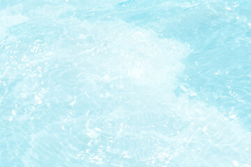Blue water with ripples on the surface. Defocus blurred transparent blue colored clear calm water surface texture with splashes and bubbles. Water waves with shining pattern texture background.
