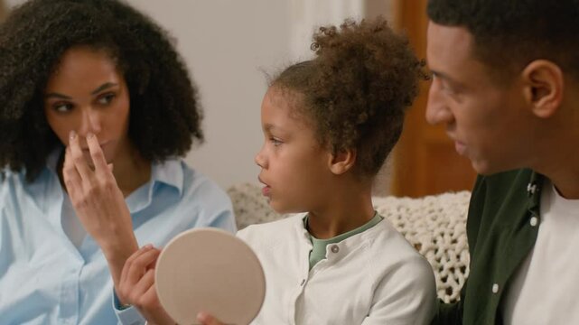 African American man woman child teach learn home doctor speech therapist mother father parents education little girl daughter sounds voice correct pronunciation letters words toddler together healthy