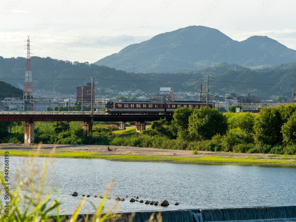 Wall mural 大和川を渡る近鉄道明寺線の電車