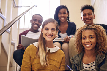 Happy, portrait and group of students at university for education, learning or open day. Smile, people and young friends on steps at college campus studying for academic scholarship admission test.