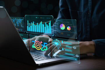 Businessman works on laptop Showing 2025 business trends dashboard with charts, metrics, AI, E-commerce, KPI. businessman planning business growth 2025. 2025 annual business plan and business strategy