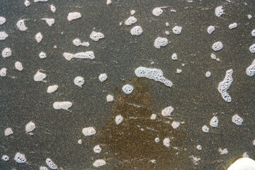 wet sand with foam