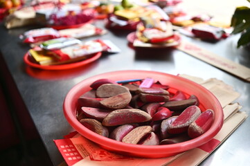 Taiwan - Jan 17, 2024: A close-up of a moon-shaped divination cup on a temple altar, showcasing the...