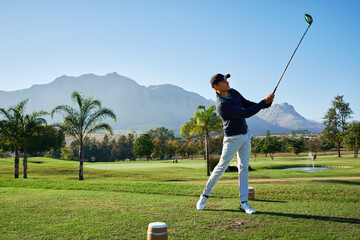 Golf course, man and swing driver for sport, training or exercise on grass outdoor. Golfer,...