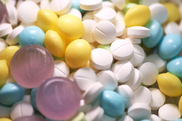 Close up of candy and medicine tablets