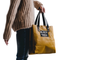 Hand holding a bag with Black friday sale banner isolated on white background