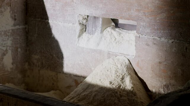 Traditional stone mill processing grains into flour in countryside area