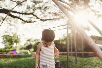 Asian little boy playing in playground, Children play development concept.