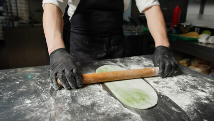 The Effort Of A Chef Using The Rolling Pin 