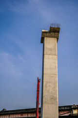 The supporting pillars for the electric train line are still under construction.