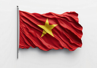 A Viet Nam flag with a yellow star on it is hanging from a white background