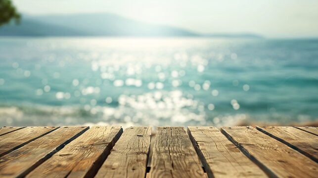 07231249 167. Clear wooden table surface with an out-of-focus ocean view behind, capturing the tranquil essence of a seaside environment