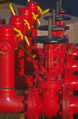 detail of brilliant red painted collection of valves at Long Island Point jetty -Victoria