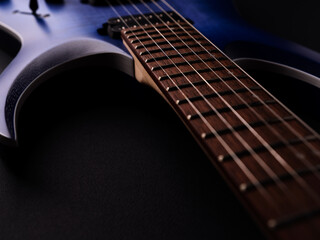 Fretboard of modern electric guitar. Close up.