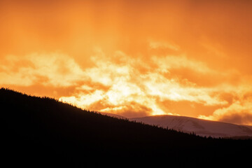 Sky alight with color in the colorado rocky mountains