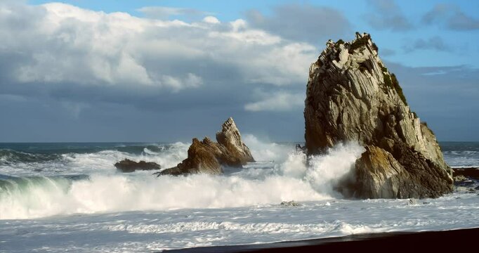 Heavy Waves Crashing in slowmotion on the white rock at new zealands coast