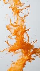 An abstract splash of orange liquid, showcasing motion and fluidity.