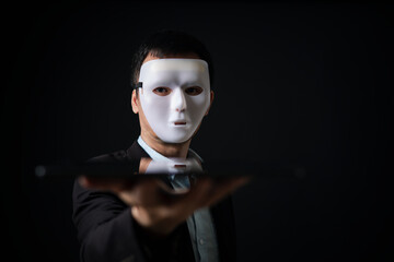 business man hide his real feeling or face behind mask, business concept in hypocrisy, fake, liar, conceal, or insincere.