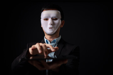  business man hide his real feeling or face behind mask, business concept in hypocrisy, fake, liar, conceal, or insincere.