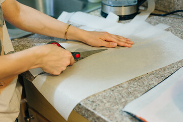 Line a baking tray with baking paper and cut the roll with scissors