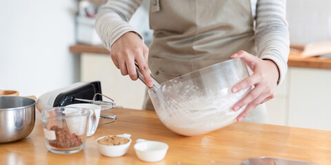 Close-up of mixing cake batter in modern kitchen setting
