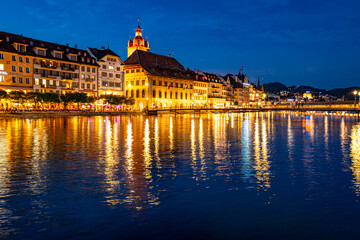 Lucern city with famous Chapel Bridge. Riverfront in Lucerne, Swiss. Lucerne city view. Canton of Lucerne. Lucern Switzerland. Sunrise in historic city center of Lucerne with lake.