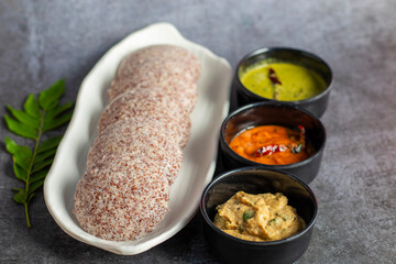 Selective focus of Soft, steamed Idli made from fermented ragi flour, rich in nutrients, perfect for a healthy breakfast.
