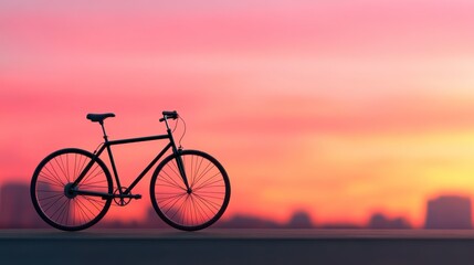 Fototapeta premium A serene bicycle silhouette against a colorful sunset sky, evoking a sense of freedom and adventure in nature.