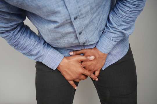 the concept of prostate and bladder problem, crotch pain of a young person 