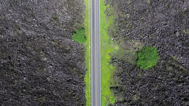 Stories of the Ceboruco volcano cover the black magma road with frozen rocks.